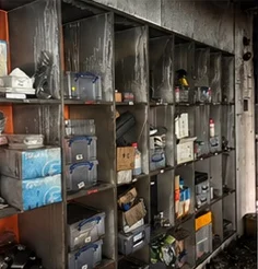 Storage shelving contaminated with soot